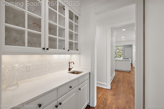 222 Arlington St, Birmingham, MI 48009 - bar area with a sink, crown molding, tasteful backsplash, wood finished floors, and recessed lighting