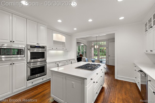 222 Arlington St, Birmingham, MI 48009 - kitchen featuring stainless steel appliances, a kitchen island, white cabinets, dark wood-style flooring, and recessed lighting