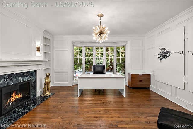 222 Arlington St, Birmingham, MI 48009 - home office with a decorative wall, built in features, crown molding, dark wood finished floors, and a premium fireplace