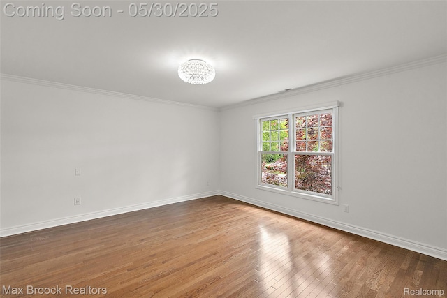 222 Arlington St, Birmingham, MI 48009 - unfurnished room featuring wood finished floors, crown molding, and baseboards