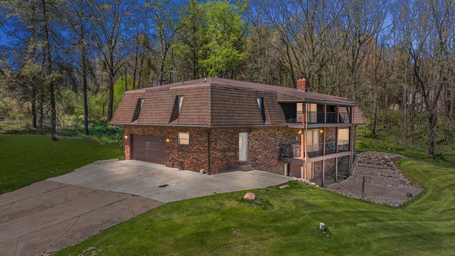 5060 Pratt Rd, Metamora, MI 48455 - view of front of property with a balcony, a front lawn, a chimney, driveway, and a tile roof