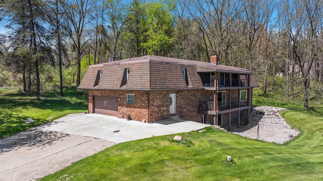 5060 Pratt Rd, Metamora, MI 48455 - view of side of property featuring a balcony, a yard, a chimney, and concrete driveway