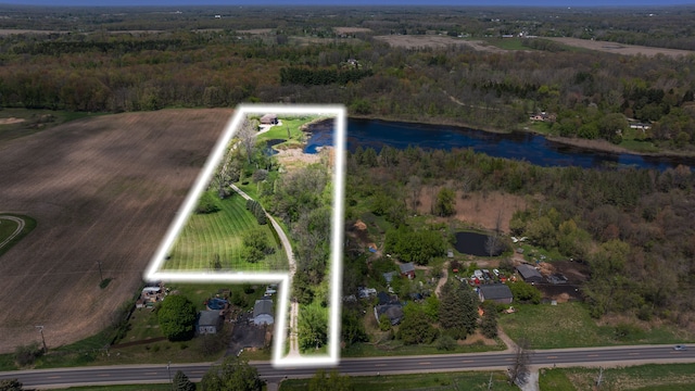 5060 Pratt Rd, Metamora, MI 48455 - aerial view of property's location with a large body of water, property boundaries highlighted, a forest, and rural landscape