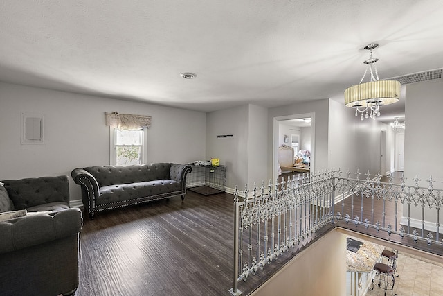 5060 Pratt Rd, Metamora, MI 48455 - living area with baseboards, wood finished floors, and a chandelier