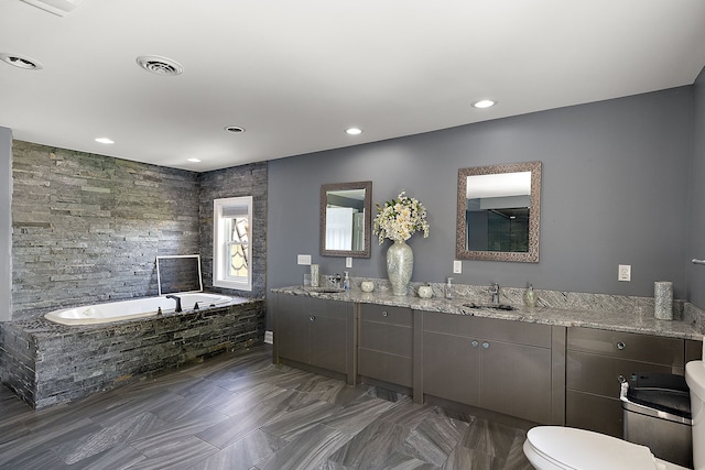5060 Pratt Rd, Metamora, MI 48455 - bathroom with a garden tub, toilet, double vanity, and recessed lighting
