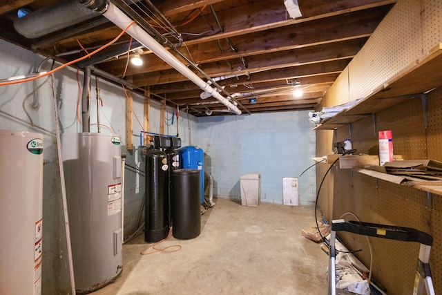 5060 Pratt Rd, Metamora, MI 48455 - unfinished below grade area featuring gas water heater, electric water heater, a water softener system, a water pressure tank, and concrete block wall