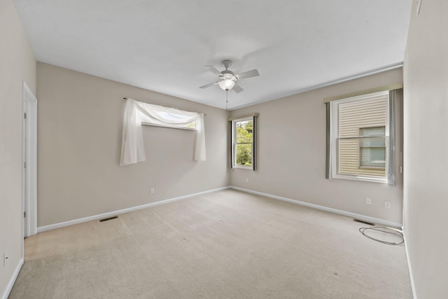 3605 Terrace Hills Ln, Jackson, MI 49203 - empty room featuring a ceiling fan, carpet floors, and baseboards