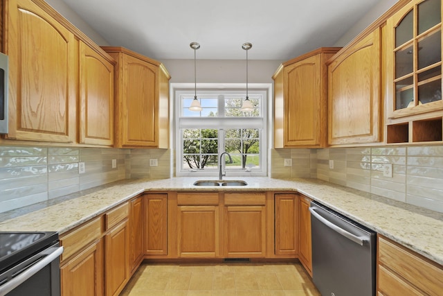 3605 Terrace Hills Ln, Jackson, MI 49203 - kitchen with stainless steel dishwasher, a sink, glass insert cabinets, decorative light fixtures, and light stone countertops