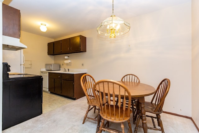 24111 Meridian Rd Unit 116, Grosse Ile, MI 48138 - dining space with a chandelier, baseboards, and light carpet