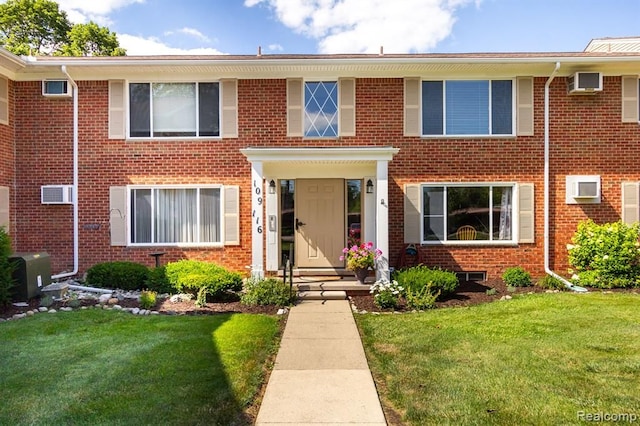 24111 Meridian Rd Unit 116, Grosse Ile, MI 48138 - view of front of property with brick siding and a front yard