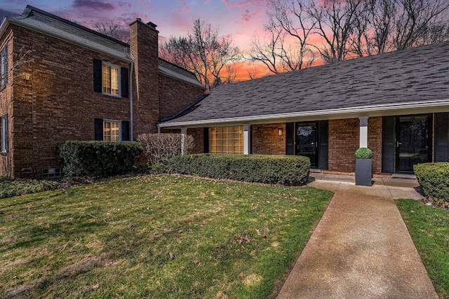 1750 Tiverton Rd Unit 28, Bloomfield Hills, MI 48304 - view of front of property with brick siding, a chimney, and a lawn