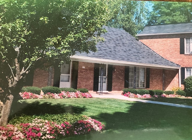 1750 Tiverton Rd Unit 28, Bloomfield Hills, MI 48304 - view of front of property featuring a front lawn, a porch, brick siding, and roof with shingles