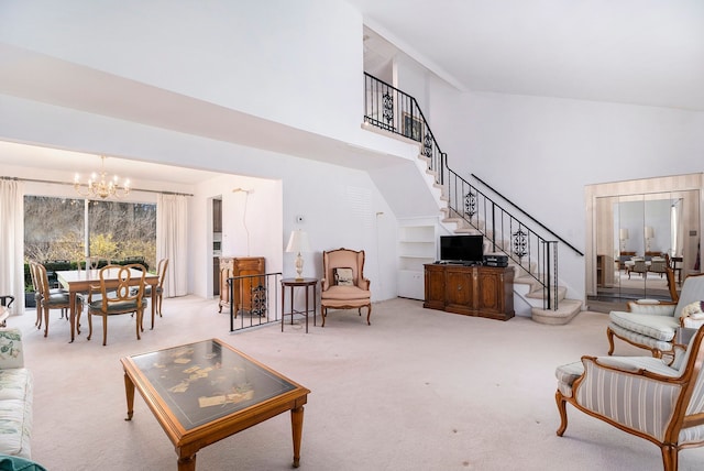 1750 Tiverton Rd Unit 28, Bloomfield Hills, MI 48304 - living area featuring a towering ceiling, a chandelier, stairs, and carpet floors