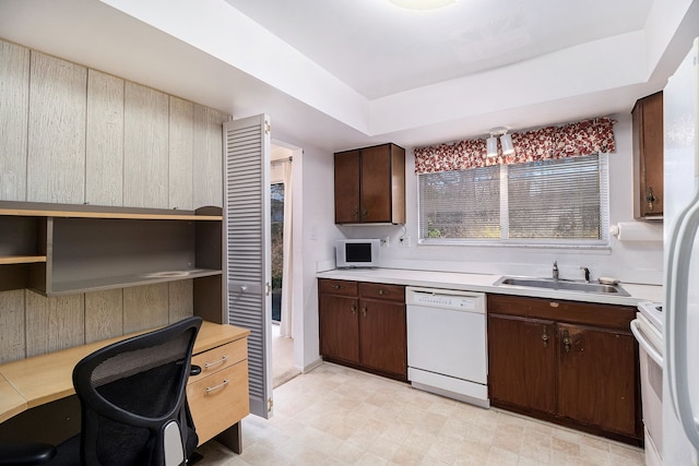 1750 Tiverton Rd Unit 28, Bloomfield Hills, MI 48304 - kitchen featuring white appliances, a sink, light countertops, and dark brown cabinets