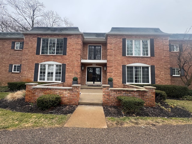 1750 Tiverton Rd Unit 28, Bloomfield Hills, MI 48304 - view of front facade featuring brick siding and french doors