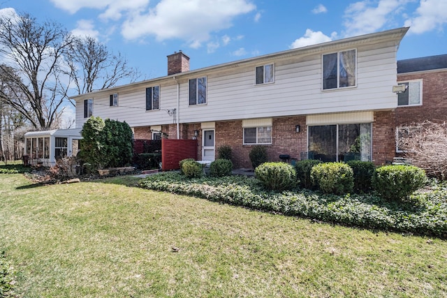 1750 Tiverton Rd Unit 28, Bloomfield Hills, MI 48304 - view of front of property featuring brick siding, a chimney, and a front yard