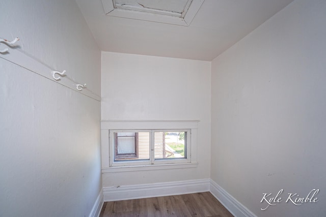 unfurnished room featuring wood finished floors and baseboards