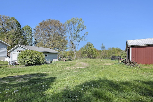25161 59 1/2 St, Bangor, MI 49013 - view of grassy yard with an outdoor structure and a garage