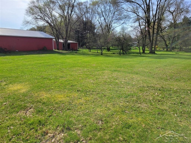 25161 59 1/2 St, Bangor, MI 49013 - view of grassy yard with a pole building and an outdoor structure