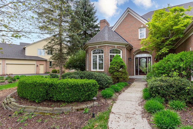 685 Dornoch Dr, Ann Arbor, MI 48103 - view of front of house featuring brick siding and a chimney