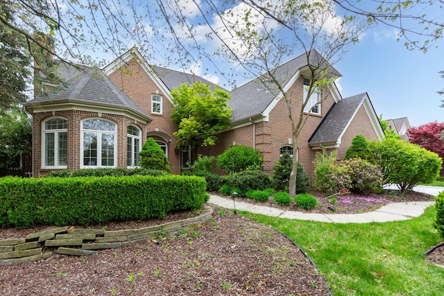 685 Dornoch Dr, Ann Arbor, MI 48103 - view of front of home with brick siding and a shingled roof