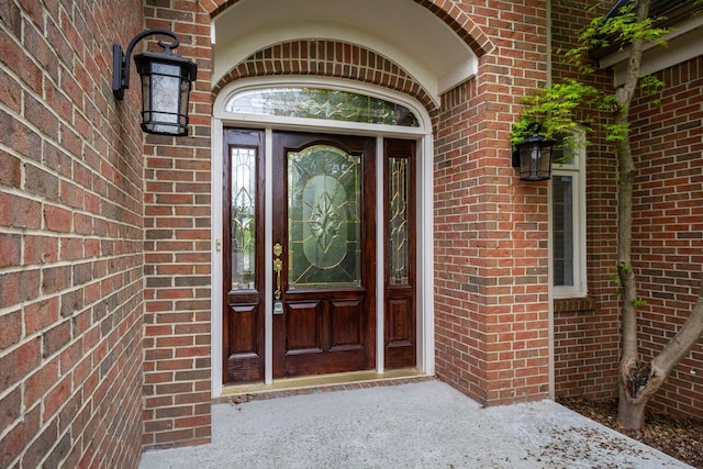 685 Dornoch Dr, Ann Arbor, MI 48103 - view of exterior entry featuring brick siding