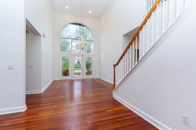 685 Dornoch Dr, Ann Arbor, MI 48103 - entrance foyer with a towering ceiling, stairway, baseboards, a chandelier, and wood finished floors