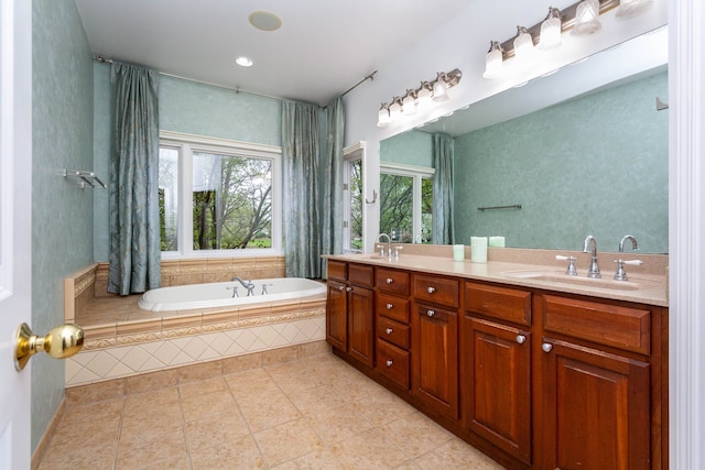 685 Dornoch Dr, Ann Arbor, MI 48103 - bathroom featuring plenty of natural light, double vanity, a bath, tile patterned floors, and recessed lighting