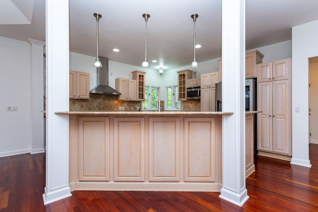 685 Dornoch Dr, Ann Arbor, MI 48103 - kitchen featuring wall chimney range hood, stainless steel microwave, glass insert cabinets, tasteful backsplash, and dark wood-type flooring