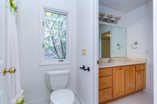 685 Dornoch Dr, Ann Arbor, MI 48103 - bathroom featuring toilet, vanity, tile patterned floors, and baseboards