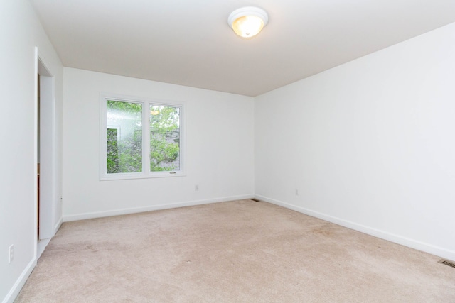 685 Dornoch Dr, Ann Arbor, MI 48103 - spare room with light carpet and baseboards
