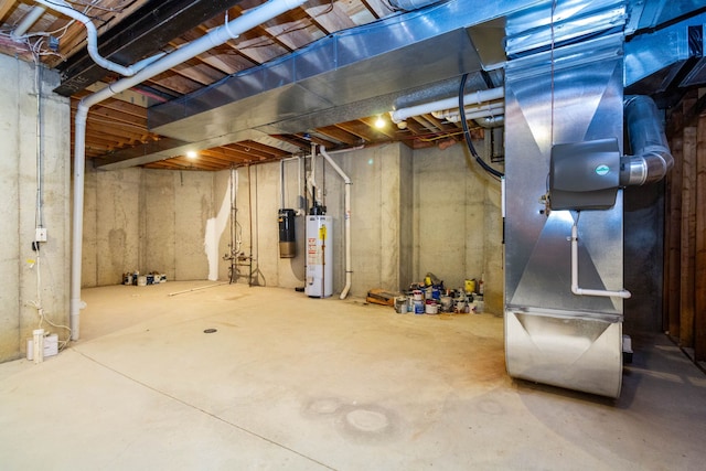 685 Dornoch Dr, Ann Arbor, MI 48103 - unfinished basement featuring water heater and heating unit