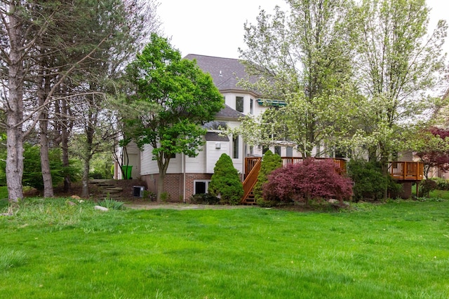 685 Dornoch Dr, Ann Arbor, MI 48103 - view of front of home featuring a front yard, a wooden deck, central air condition unit, and stairway