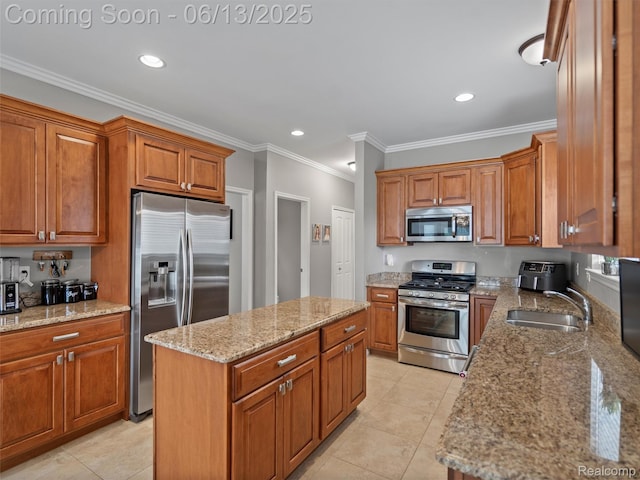 45877 Andrew Dr, Macomb, MI 48044 - kitchen featuring appliances with stainless steel finishes, brown cabinetry, a center island, light stone countertops, and ornamental molding