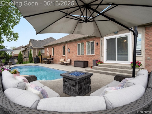 45877 Andrew Dr, Macomb, MI 48044 - view of pool with an outdoor living space with a fire pit, a patio area, and outdoor dining space