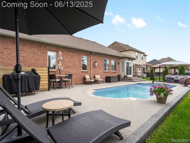 45877 Andrew Dr, Macomb, MI 48044 - view of pool with an outdoor living space, a patio, and area for grilling