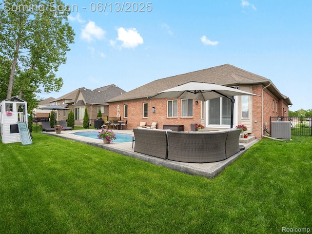 45877 Andrew Dr, Macomb, MI 48044 - rear view of property with an outdoor living space, brick siding, a patio area, and a shingled roof