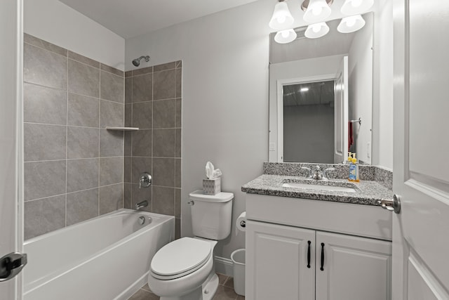 bathroom with toilet, vanity, and shower / tub combination