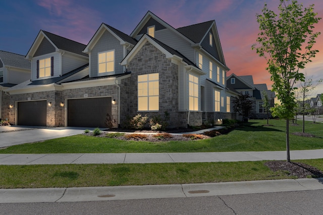 craftsman inspired home with stone siding, an attached garage, concrete driveway, and a front yard