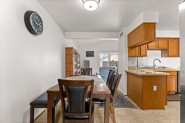 6809 Kingsley St, Dearborn, MI 48126 - dining area with light tile patterned floors, lofted ceiling, and baseboards