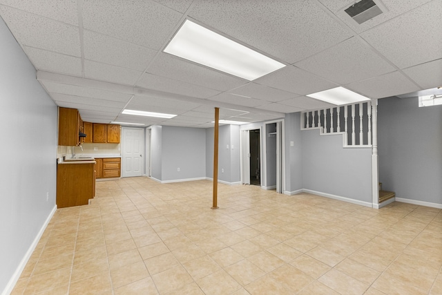 6809 Kingsley St, Dearborn, MI 48126 - finished below grade area with a paneled ceiling, stairs, and baseboards
