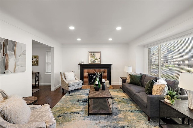 16573 Griggs St, Detroit, MI 48221 - living room with recessed lighting, wood finished floors, a brick fireplace, and baseboards