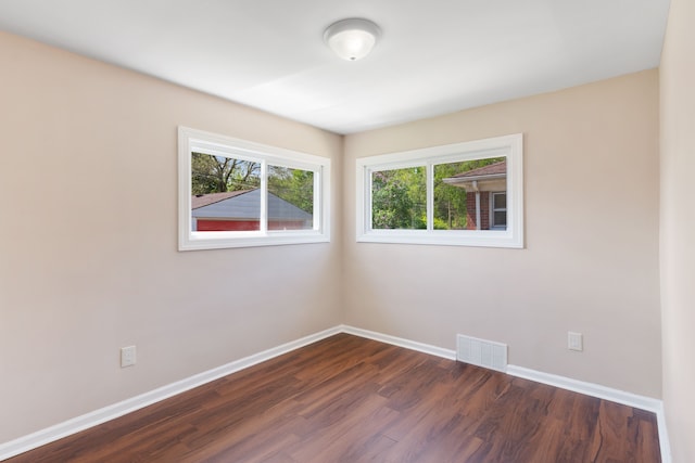 11580 Findlay St, Detroit, MI 48205 - empty room with dark wood-style floors and baseboards
