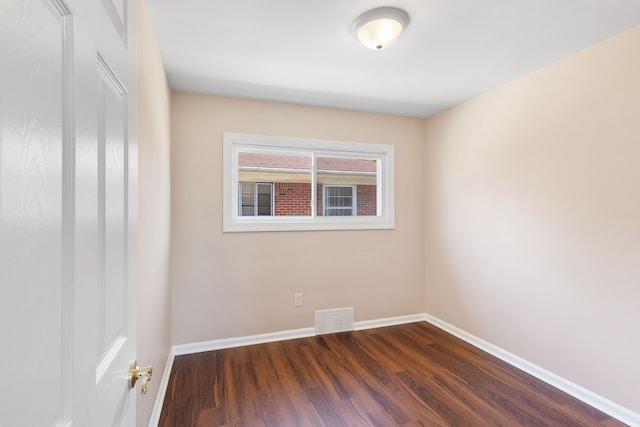 11580 Findlay St, Detroit, MI 48205 - spare room featuring dark wood-type flooring and baseboards