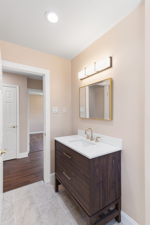 11580 Findlay St, Detroit, MI 48205 - bathroom with baseboards, vanity, and tile patterned flooring