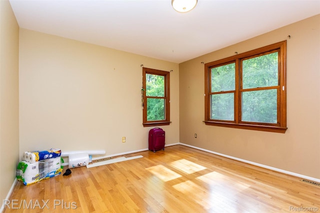 3168 Farmbrook Ln, Metamora, MI 48455 - spare room featuring wood finished floors and baseboards