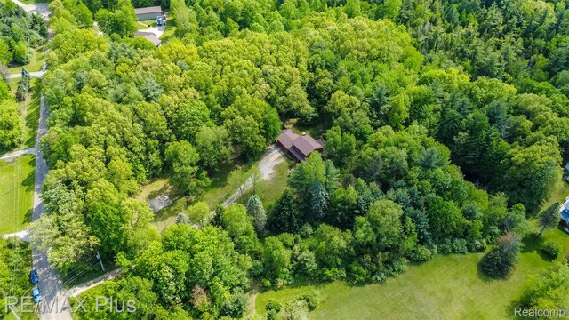 3168 Farmbrook Ln, Metamora, MI 48455 - aerial view of a heavily wooded area