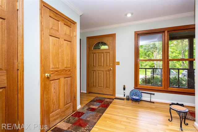 3168 Farmbrook Ln, Metamora, MI 48455 - entrance foyer with wood finished floors, baseboards, and crown molding