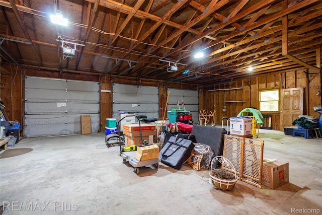 3168 Farmbrook Ln, Metamora, MI 48455 - garage featuring a garage door opener