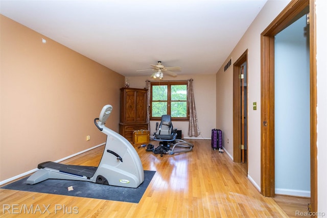 3168 Farmbrook Ln, Metamora, MI 48455 - workout area with a ceiling fan, wood finished floors, and baseboards